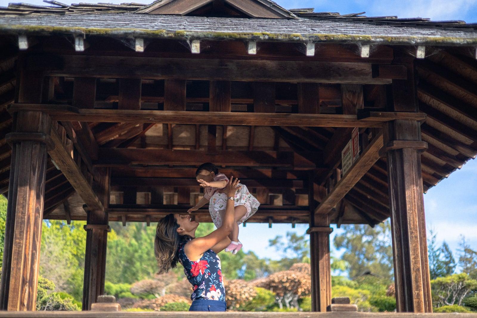 Dr. Sampada Deshpande holding a child outdoors